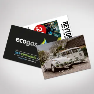 Three printed Postcards featuring one with a wedding car.